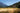 Man hiking through woods down trail